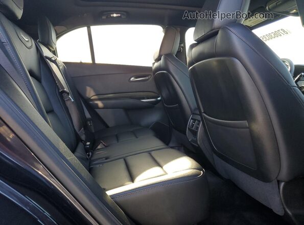 1GYFZER47PF100682 2023 CADILLAC XT4 Black Vista interior trasera
