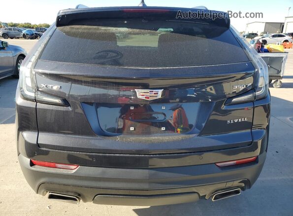 1GYFZER47PF100682 2023 CADILLAC XT4 Black Vista trasera