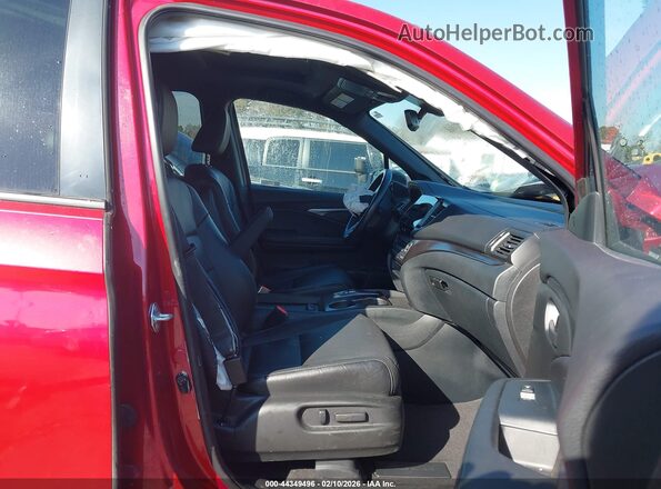 5FNYF8H56PB020040 2023 HONDA PASSPORT Red Front interior view