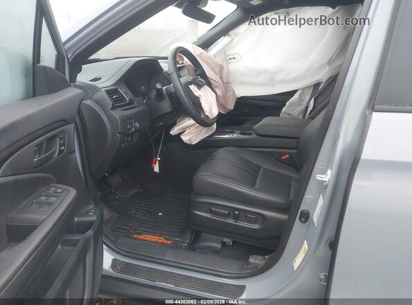 5FNYF8H64SB000094 2025 HONDA PASSPORT Light Blue Vista interior delantera