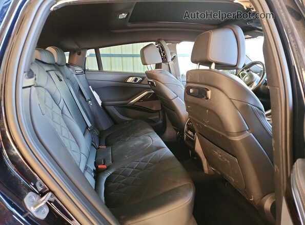5UX33EX08S9W74479 2025 BMW X6 Black Vista interior trasera