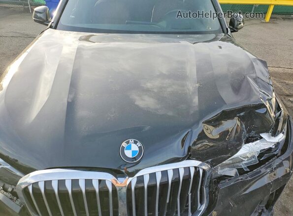 5UXCW2C08N9K61736 2022 BMW X7 Black Vista interior trasera