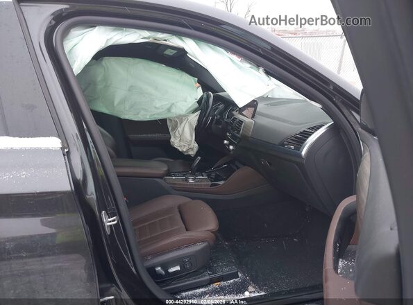 5UXUJ3C59KLG56269 2019 BMW X4 Gray Front interior view