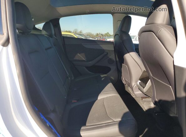 7SAYGDED9TA500973 2026 TESLA MODEL White Vista de los asientos traseros