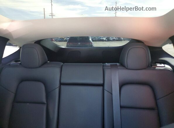 7SAYGDEDXSF227916 2025 TESLA MODEL Blue Rear interior view