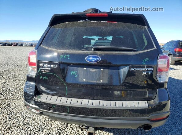 JF2SJGEC1HH476502 2017 SUBARU FORESTER2. Black Rear view