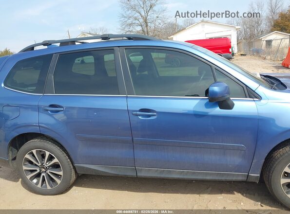 JF2SJGEC3JH414802 2018 SUBARU FORESTER2. Blue Vista interior trasera