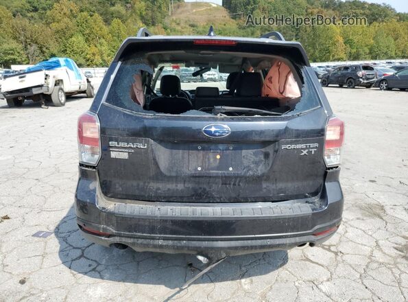 JF2SJGWC4JH575755 2018 SUBARU FORESTER2. Charcoal Rear view