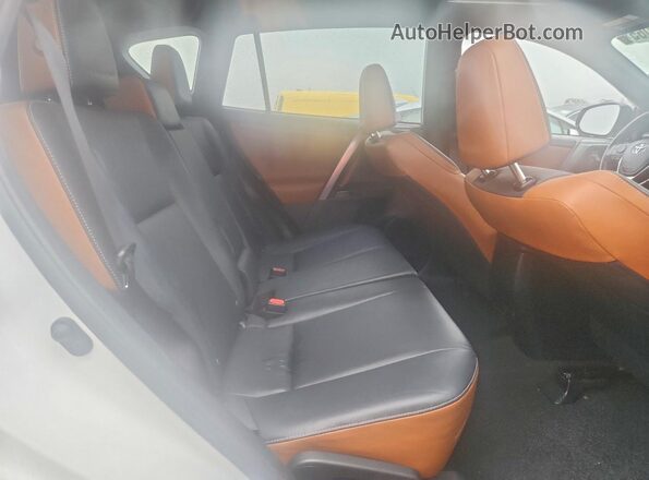JTMJFREV2GD180032 2016 TOYOTA RAV4 White Rear interior view