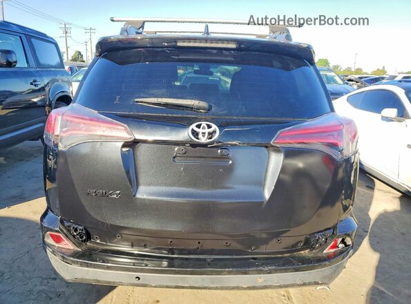 JTMJJREVXHD088005 2017 TOYOTA RAV4 Black Вид ззаду