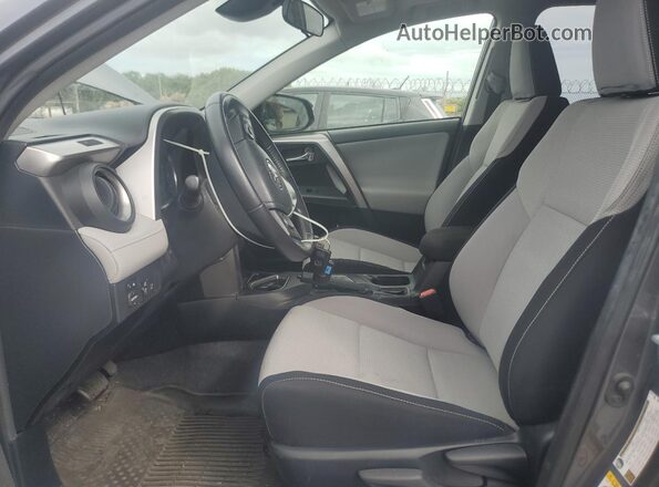 JTMWFREV9GD087384 2016 TOYOTA LE Charcoal Vista interior delantera