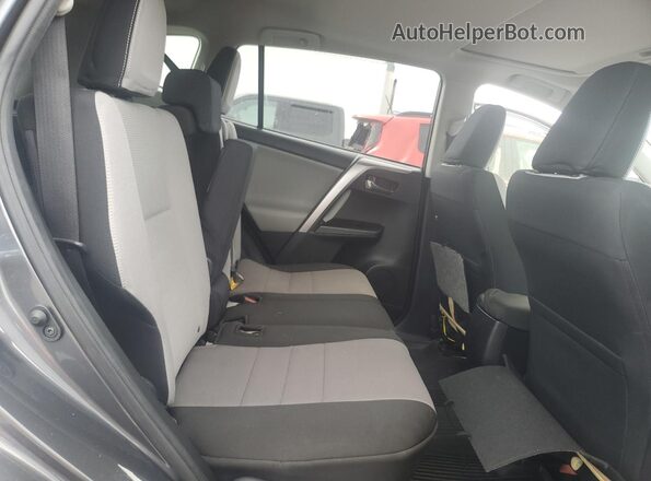 JTMWFREV9GD087384 2016 TOYOTA LE Charcoal Vista interior trasera