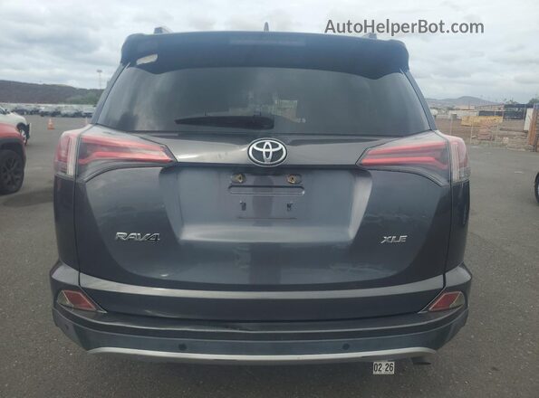 JTMWFREV9GD087384 2016 TOYOTA LE Charcoal Vista trasera