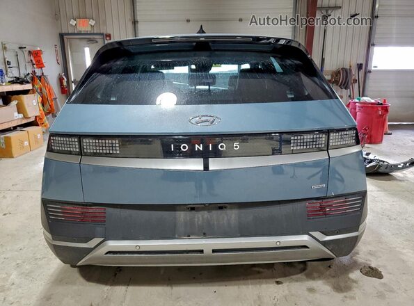 KM8KNDAF9PU192599 2023 HYUNDAI IONIQ Blue Widok z tyłu