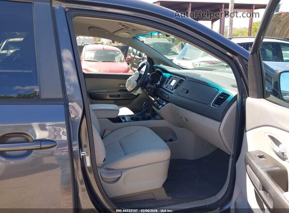 KNDMB5C13G6116409 2016 KIA SEDONA Gray Vista interior delantera