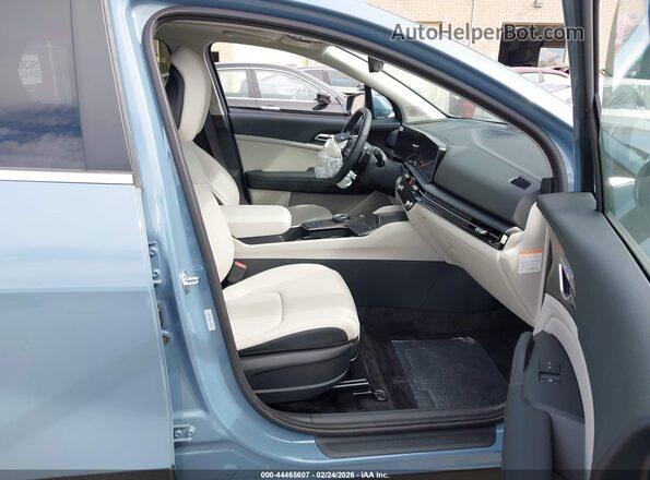 KNDPVDDG6T7285295 2026 KIA SPORTAGE HYBRID Light Blue Вид салону спереду