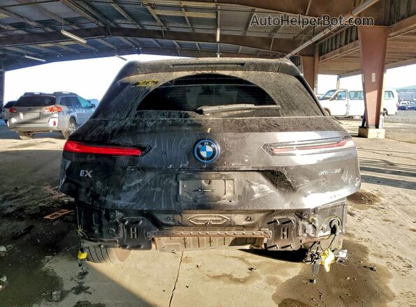 WB523CF02RCR19806 2024 BMW IX Black Widok z tyłu