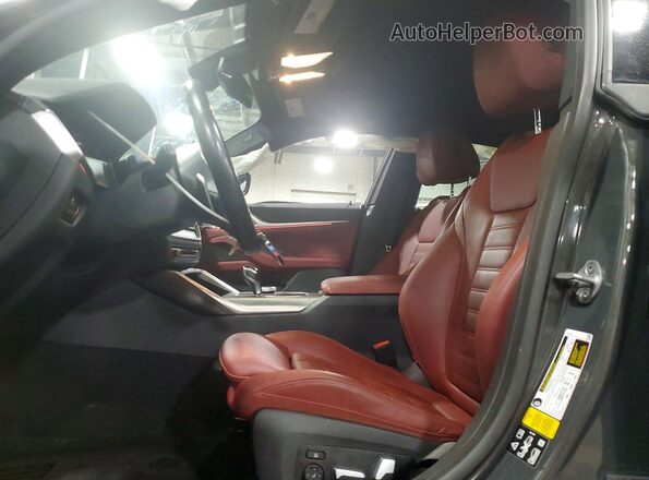 WBA13AW04PFN94444 2023 BMW M4 Gray Widok wnętrza z przodu