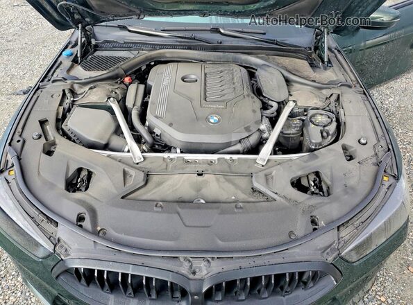 WBAAE2C00RCN72191 2024 BMW 8 SERIES Green Սալոնի հետևի տեսք