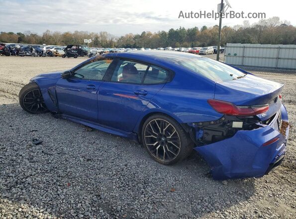 WBAGV8C02PCL67191 2023 BMW M8 Blue Rear left