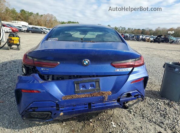 WBAGV8C02PCL67191 2023 BMW M8 Blue Rear view