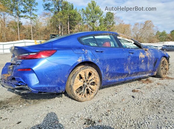 WBAGV8C02PCL67191 2023 BMW M8 Blue Rear right