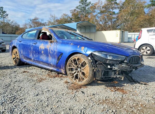 WBAGV8C02PCL67191 2023 BMW M8 Blue Front right