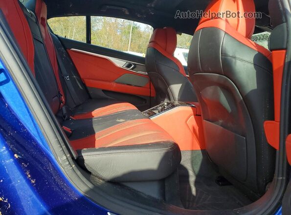 WBAGV8C02PCL67191 2023 BMW M8 Blue Rear seats view