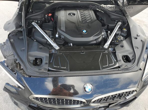 WBAHF9C01LWW40007 2020 BMW Z4 Black Vista interior trasera