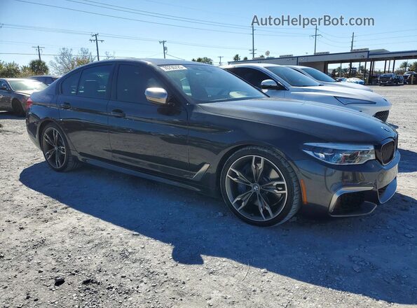 WBAJS7C06LCD34796 2020 BMW M5 Charcoal Front right