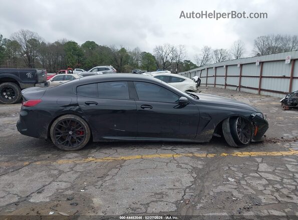 WBSGV0C06PCL37737 2023 BMW M8 Black Vista interior trasera