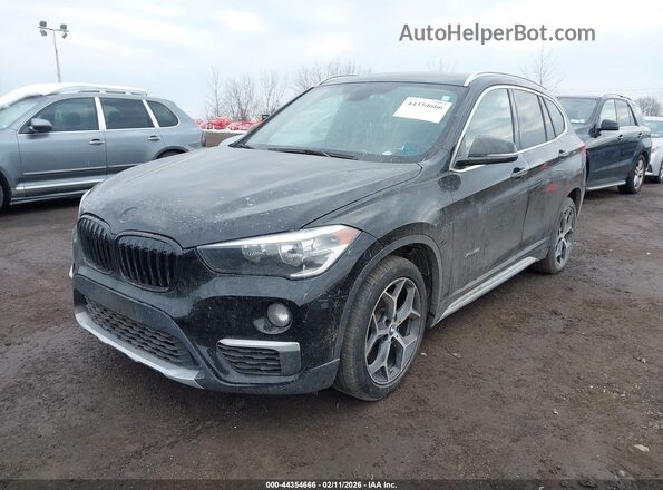 WBXHT3C30GP883734 2016 BMW X1 Black Front view