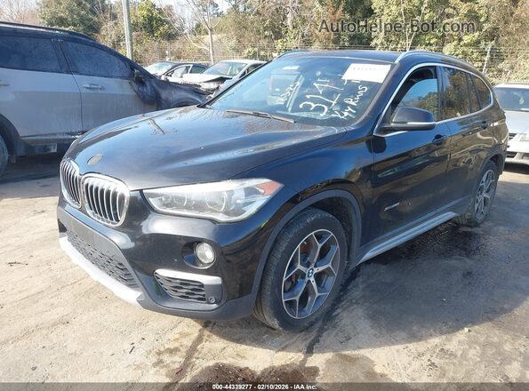 WBXHT3C34H5F83145 2017 BMW X1 Черный Передняя левая четверть