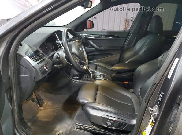 WBXHT3C59K5L90477 2019 BMW X1 Charcoal Front interior view