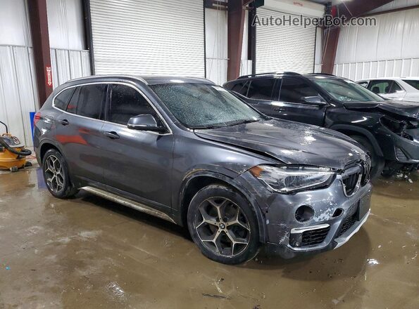 WBXHT3C59K5L90477 2019 BMW X1 Charcoal Front right