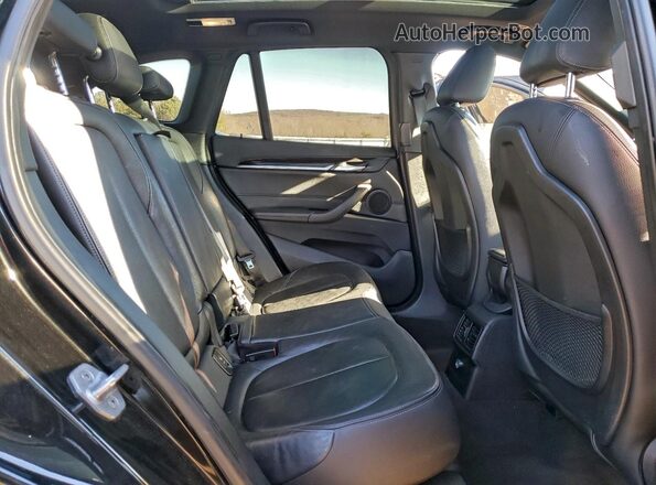 WBXHT3Z33G4A50294 2016 BMW X1 Black Vista interior trasera