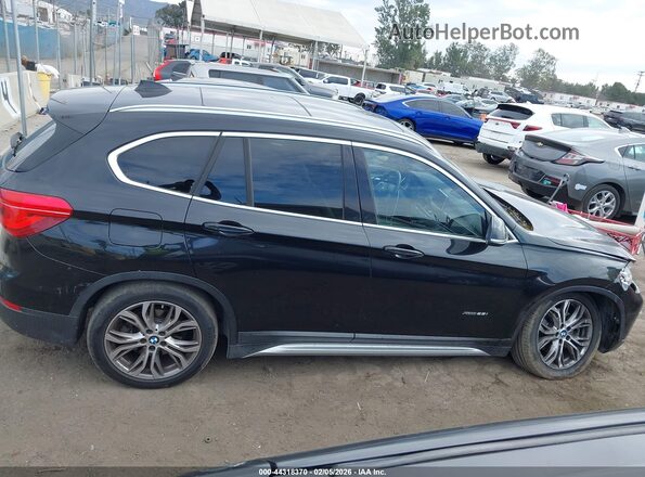 WBXHT3Z34G4A49252 2016 BMW X1 Черный Вид задней части салона