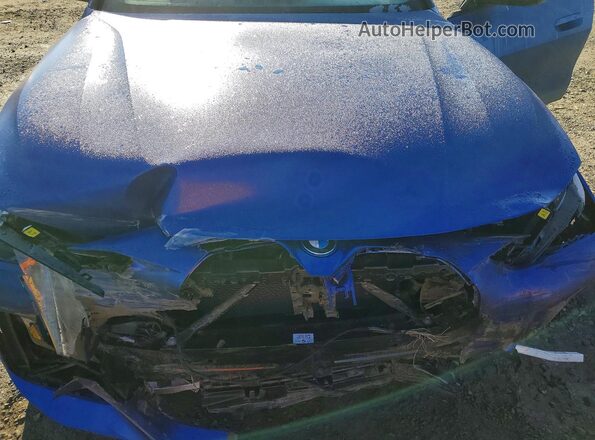 WBY33AW07NFM77108 2022 BMW I4 Blue Սալոնի հետևի տեսք