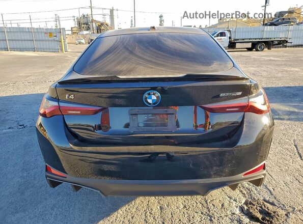 WBY43AW0XRFT38133 2024 BMW I4 Black Vista trasera