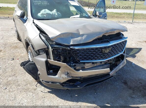 1GYFZCR45SF104940 2025 CADILLAC XT4 Золотой Вид спереди