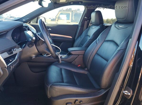 1GYFZDR4XNF131075 2022 CADILLAC XT4 Black Front interior view