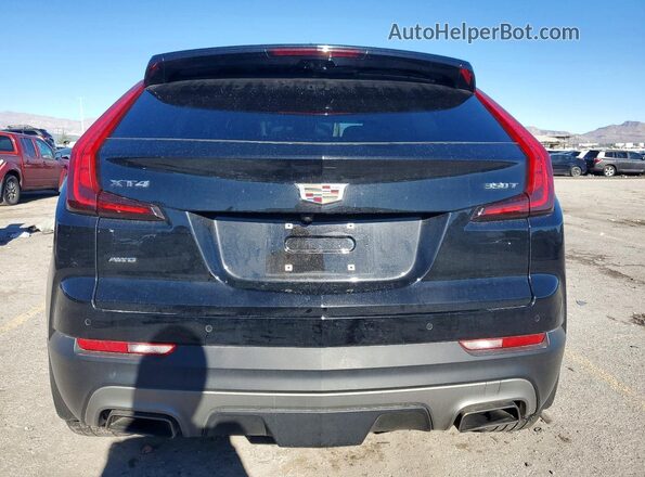 1GYFZDR4XNF131075 2022 CADILLAC XT4 Black Rear view