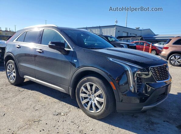 1GYFZDR4XNF131075 2022 CADILLAC XT4 Black Front right
