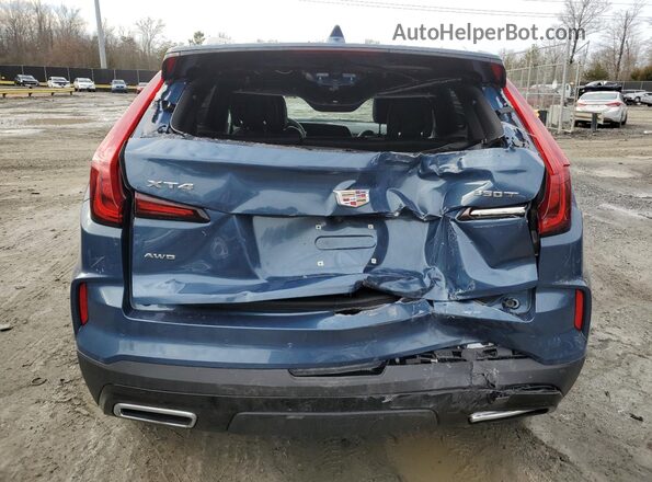 1GYFZDR4XRF166107 2024 CADILLAC XT4 Blue Widok z tyłu