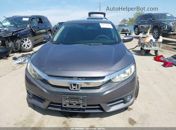 2HGFC1F39GH647173 2016 HONDA CIVIC Gray Rear interior view