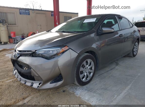 2T1BURHE0HC779757 2017 TOYOTA LL Желто-коричневый Передняя левая четверть