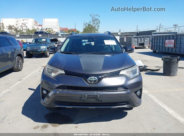 2T3RFREV1JW696654 2018 TOYOTA RAV4 Gray Vista del cuadro de instrumentos