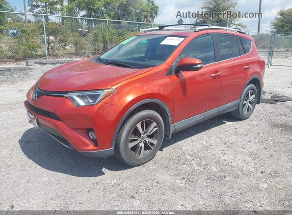 2T3RFREV9GW495674 2016 TOYOTA LE Orange Front left