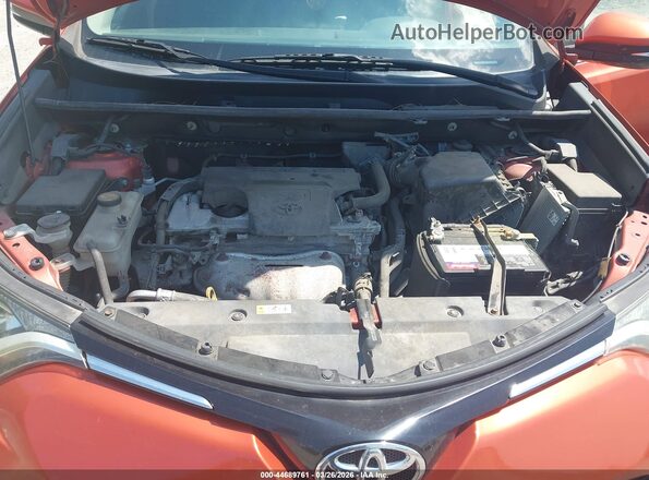 2T3RFREV9GW495674 2016 TOYOTA LE Orange Rear view