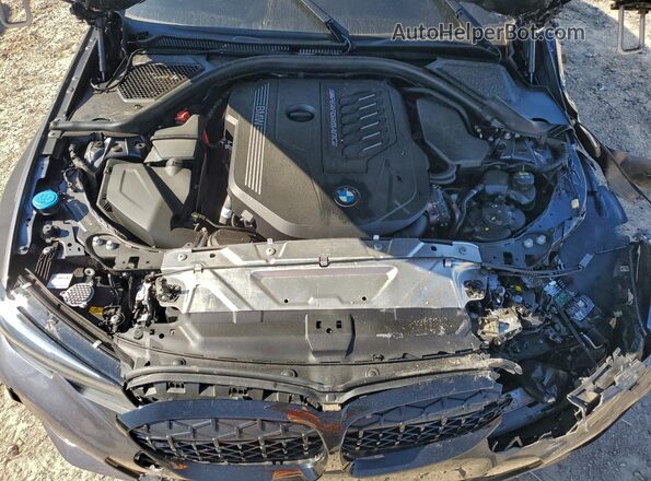 3MW5U9J04N8C36075 2022 BMW M3 Gray Vista interior trasera